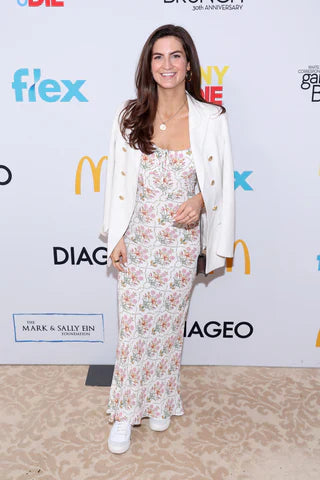 What is the necklace that Kaitlan Collins' wearing?